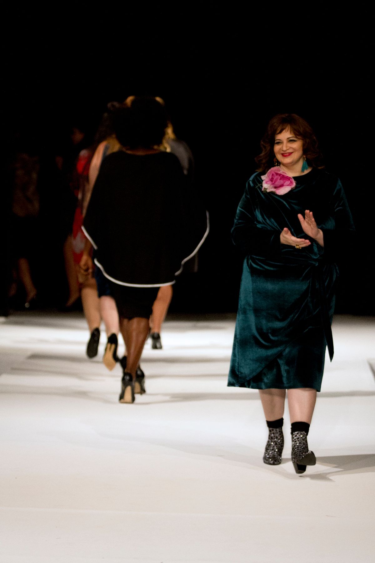 Designer Yona Love, of Yona New York, taking a bow at The World Fashion Parade  | Photographed by David Guerrieri